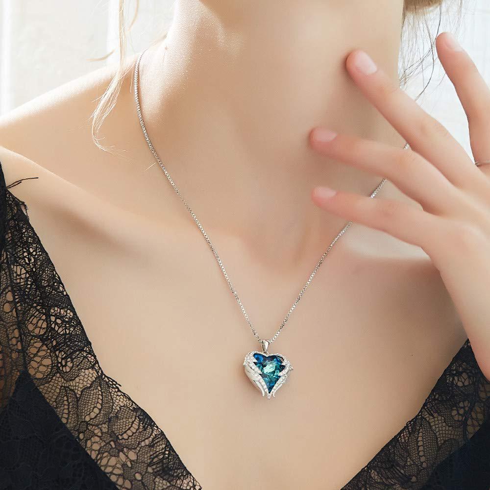Wings of an Angel Heart Blue Topaz Necklace and Earring Set   - ALILY