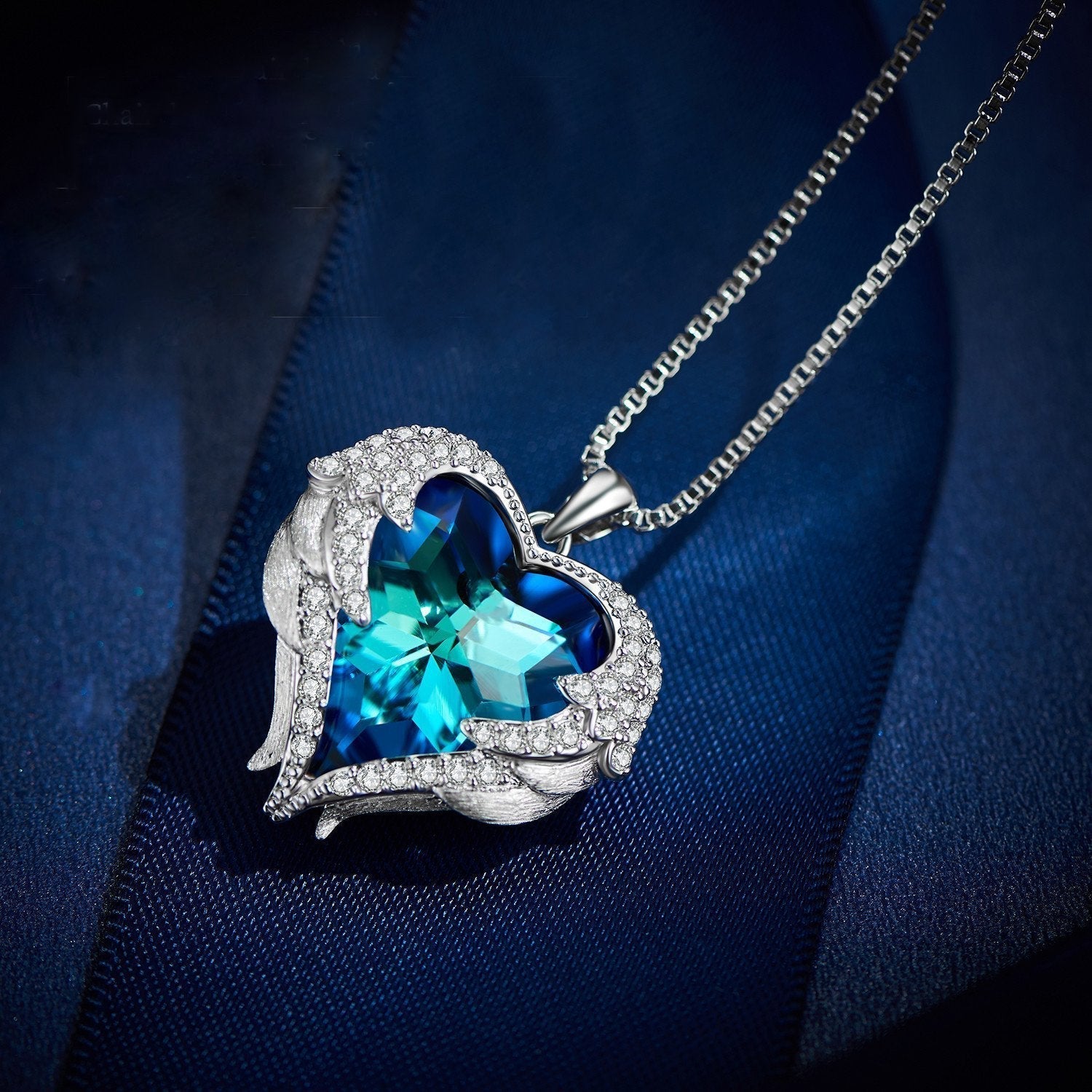 Wings of an Angel Heart Blue Topaz Necklace and Earring Set   - ALILY