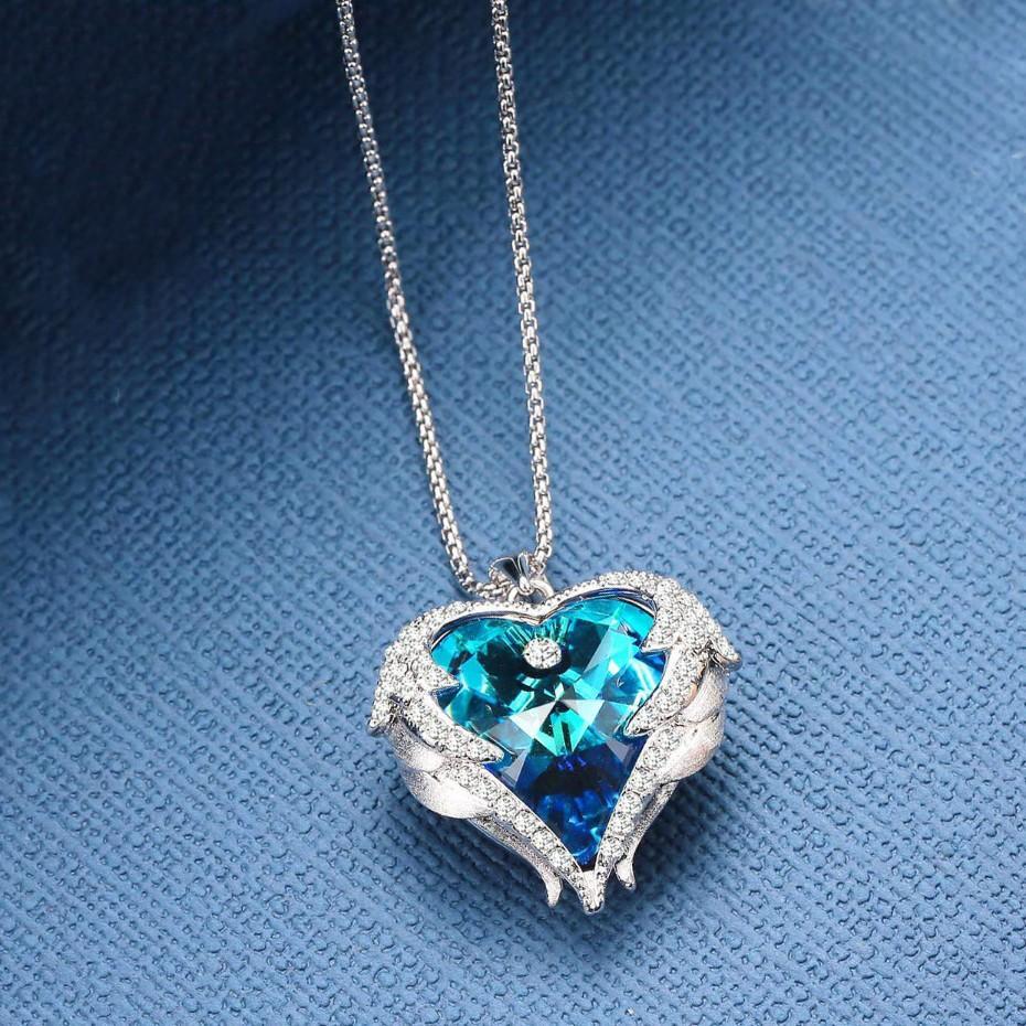 Wings of an Angel Heart Blue Topaz Necklace and Earring Set   - ALILY
